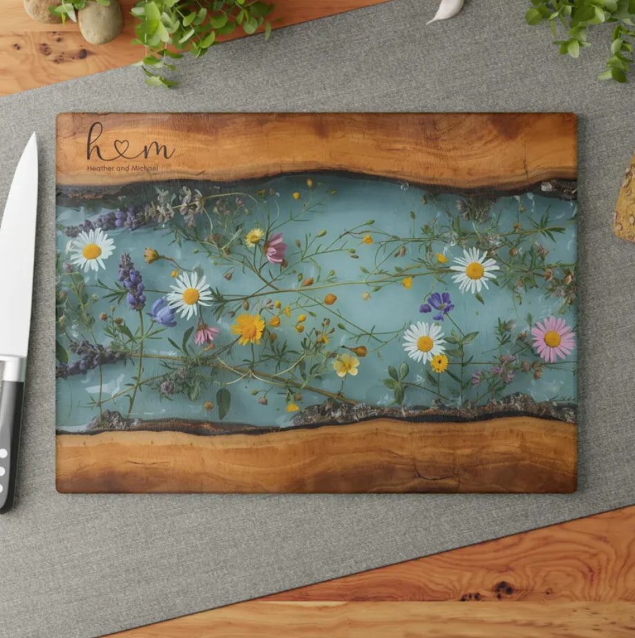Wooden cutting board with floral design and personalized names