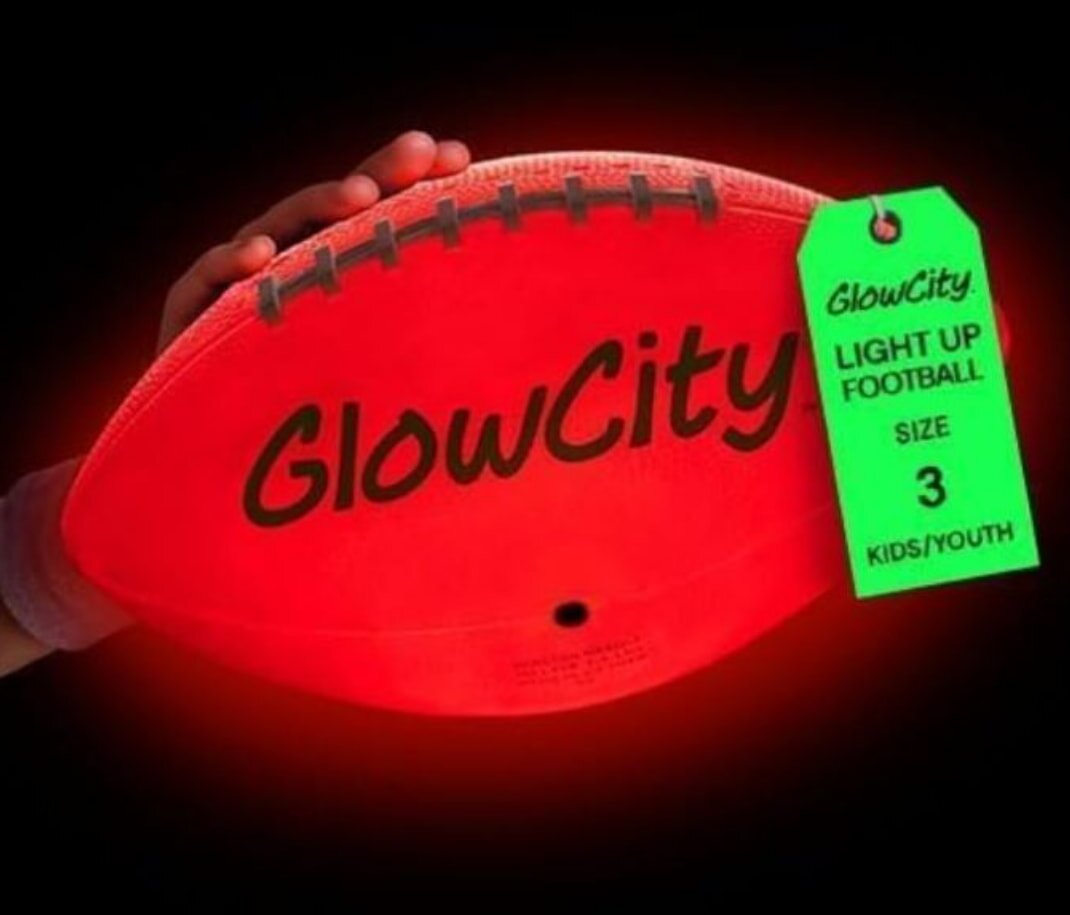 A collection of red glow city footballs arranged together, showcasing their vibrant color and illuminated design.