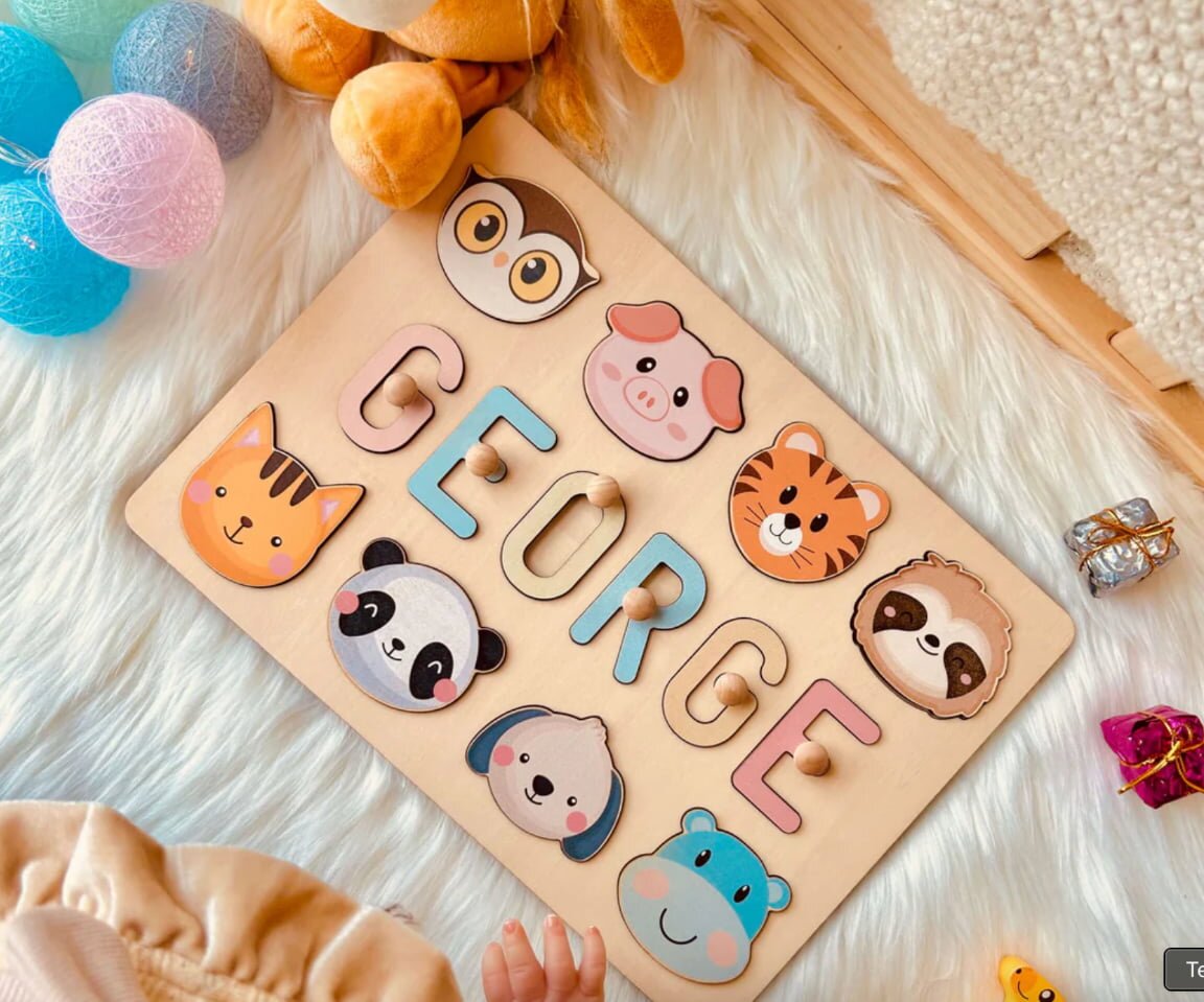 Personalized wooden puzzle featuring colorful animals and letters, designed for educational play and skill development.