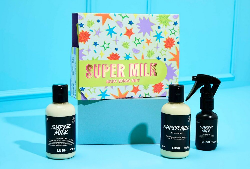 Super milk gift set featuring a bottle of hair care, body wash, and shampoo arranged together.