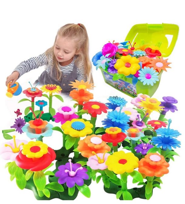 A young girl joyfully playing with a colorful plastic flower garden, surrounded by vibrant flowers and greenery.