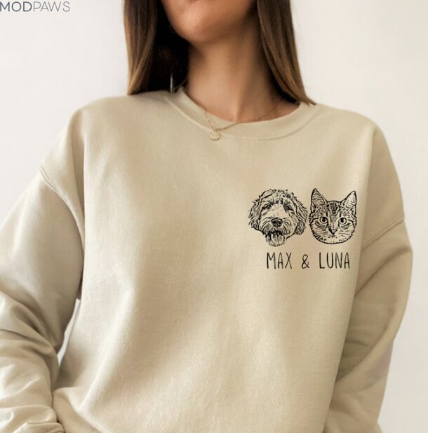 A woman in a sweatshirt featuring the words "Max" and "Luna" prominently displayed on the front.