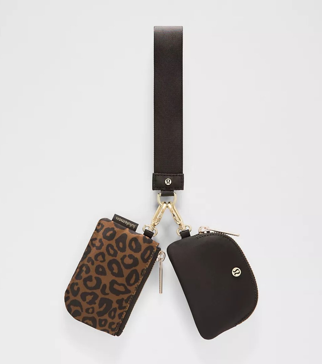 Leopard print leather wallet with a sleek design, showcasing a stylish and bold animal pattern.