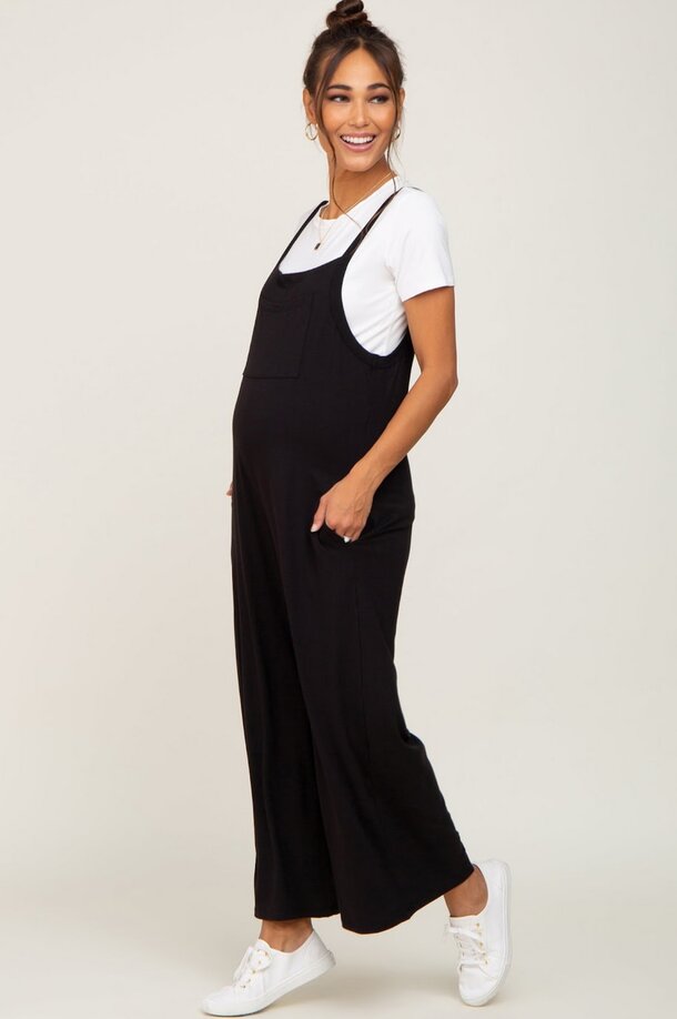 Black maternity jumpsuit made of soft jersey fabric featuring a high waist design for comfort and style.