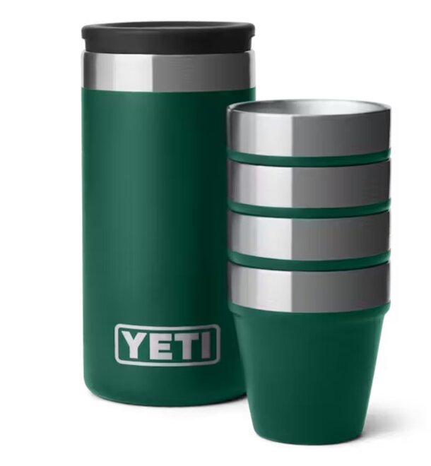 Green Yeti tumbler with four matching cups arranged around it on a neutral background.