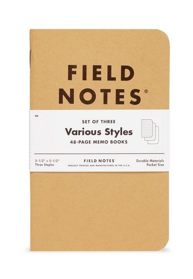 Field Notes memo book set of three, 48 pages each, in a brown cover with a white label, showcasing various styles.