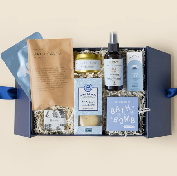 A blue gift box filled with an assortment of various products, showcasing a colorful and diverse selection.