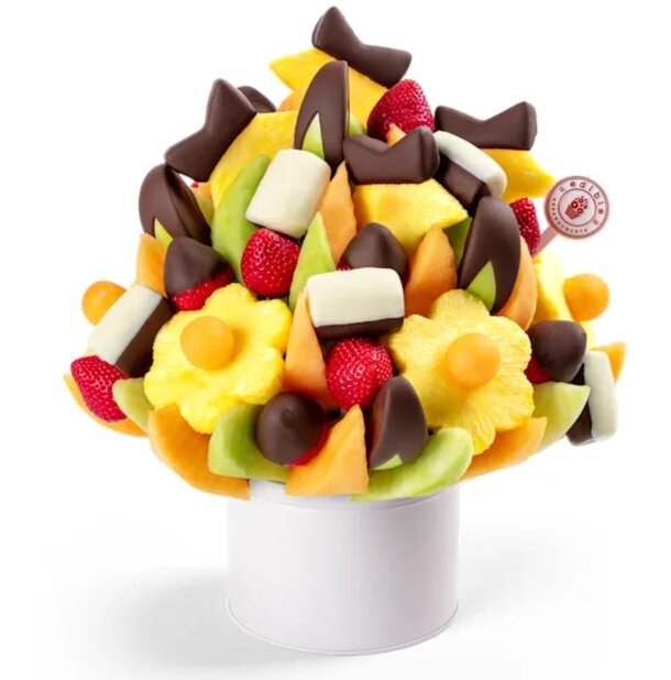 A vibrant bouquet featuring assorted fresh fruits and chocolate-covered fruits arranged artistically.