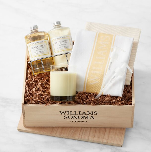 A beautifully arranged Williams Sonoma gift set featuring gourmet food items and kitchen accessories in an elegant box.