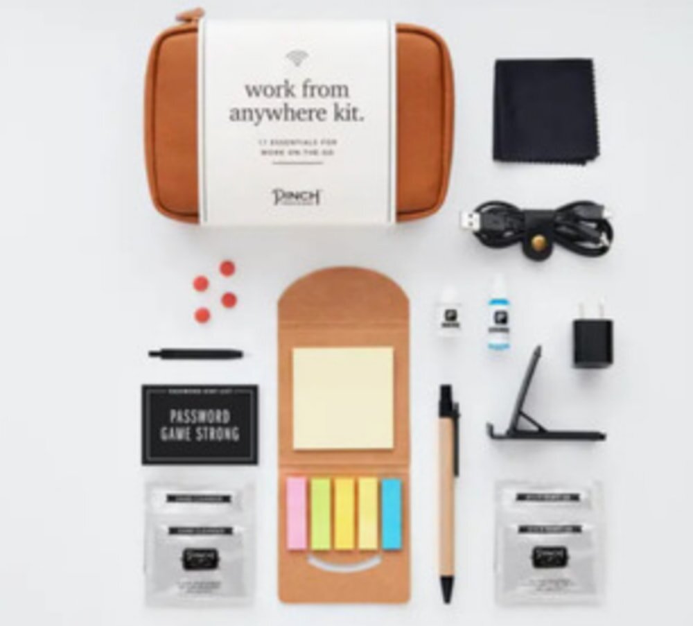 Work from anywhere kit featuring a pen, notepad, pen holder, and various other essential items for productivity.
