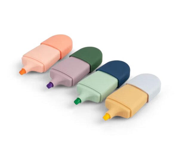 A set of four colored pens in red, blue, green, and yellow arranged on a white surface.
