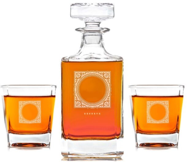 A glass decanter with two whiskey glasses, elegantly arranged on a wooden surface, showcasing a rich amber liquid.