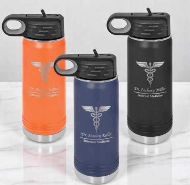 Three stainless steel water bottles in different colors: blue, green, and red, arranged side by side on a white background.