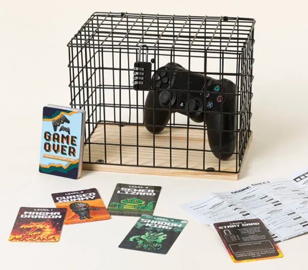 A cage containing a game controller and playing cards, symbolizing confinement in gaming or entertainment.
