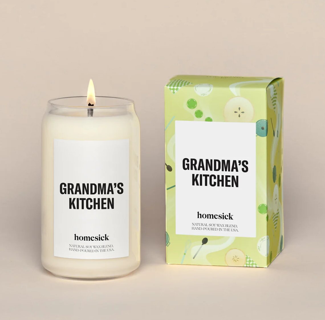 A warm candle flickers on a wooden kitchen table, evoking a cozy atmosphere reminiscent of grandma's cooking.