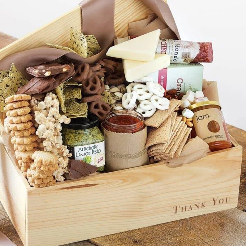 A beautifully arranged thank you gift basket filled with assorted treats and a heartfelt note of appreciation.