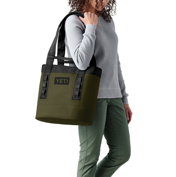 Yeti tote bag made from durable, waterproof material, ideal for outdoor activities and protecting contents from moisture.
