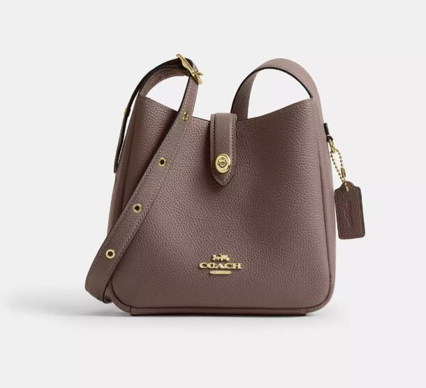 Leather Coach crossbody bag featuring a sleek design and adjustable strap for versatile wear.