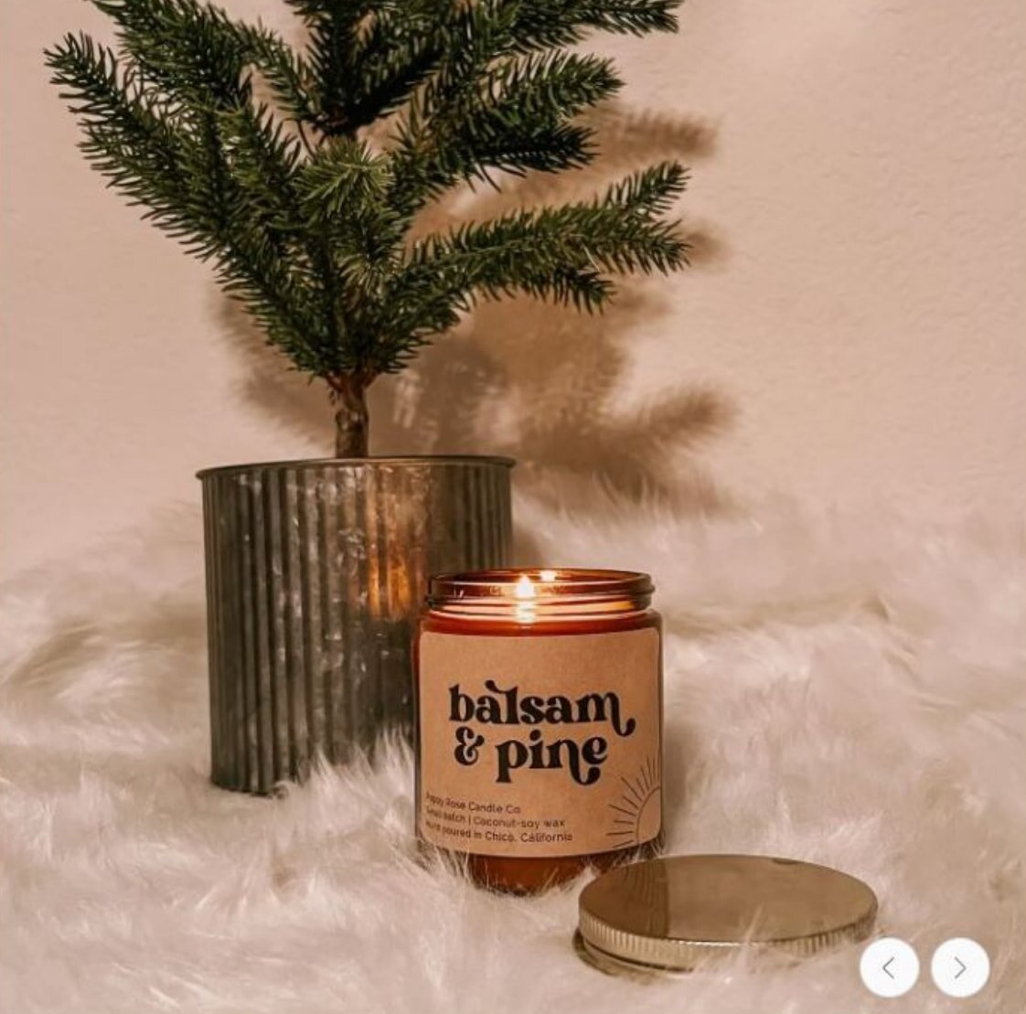 A woman holds a phone in one hand and a gift card in the other, smiling as she engages with the app.