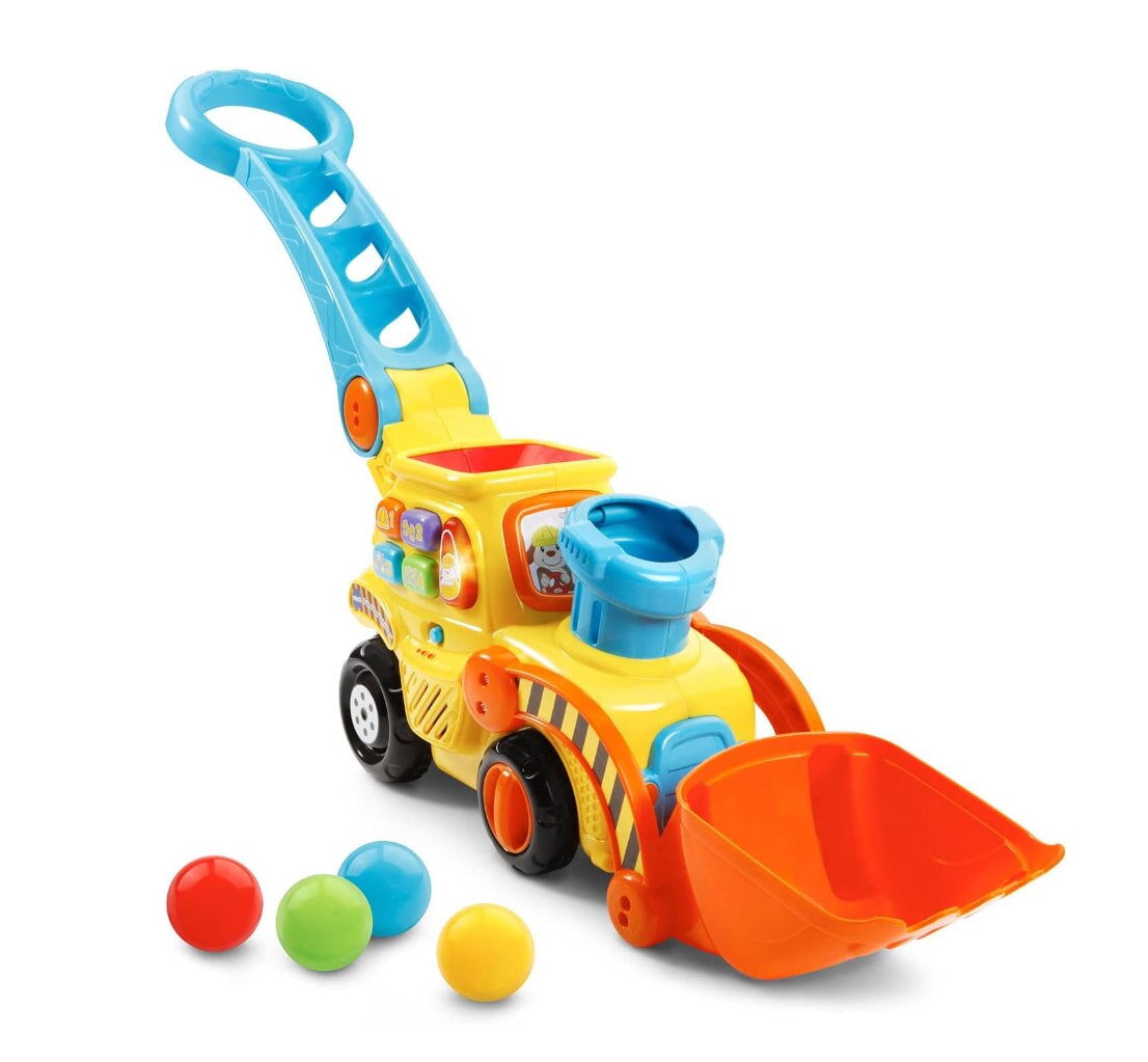 A toy construction vehicle with a shovel and colorful balls, designed for imaginative play and learning.