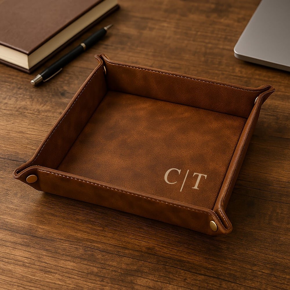 Square personalized valet tray engraved with initials, holding keys, a wallet, and a watch.