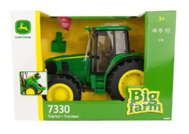 A toy tractor displayed in its packaging, featuring bright colors and a clear plastic window for visibility.