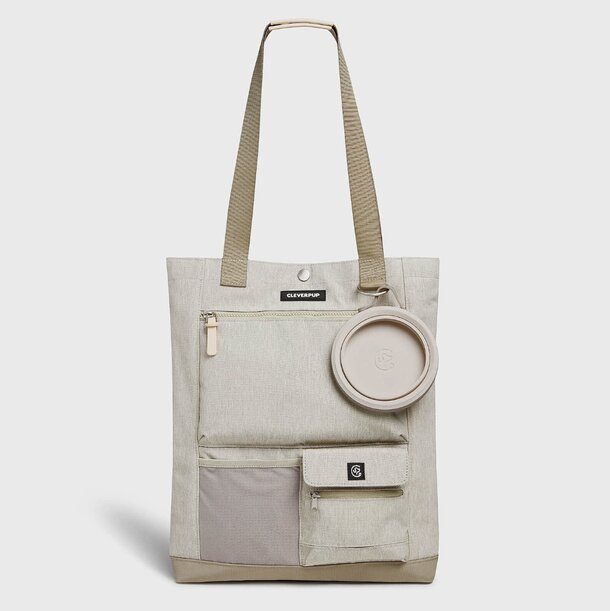 A tote bag containing a small cup and a small bag, showcasing a practical and stylish accessory for daily use.