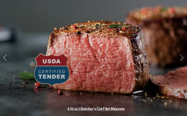 A steak on a table with a label reading "USA Certified Tenderizer" prominently displayed beside it.