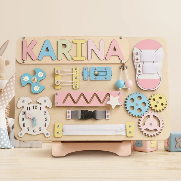 A wooden toy featuring the name "Karina" carved on its surface, showcasing a personalized design.