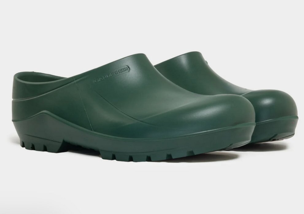 A pair of green clogs featuring rubber outsoles, designed for comfort and durability.
