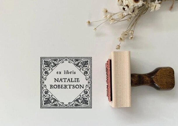 Vintage Robert Foy rubber stamp featuring intricate design and classic typography, showcasing its historical significance.