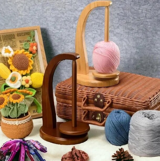 A basket filled with colorful yarn sits beside a wooden stand, ready for knitting or crafting projects.