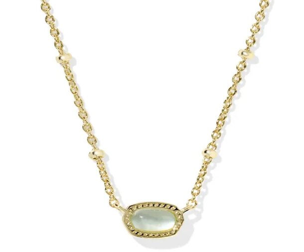 A close-up of a yellow stone pendant hanging from a delicate gold chain, highlighting its striking appearance.