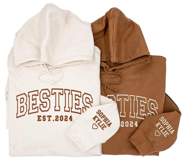 A pair of hoodies with the word "besties" printed on them, showcasing friendship.