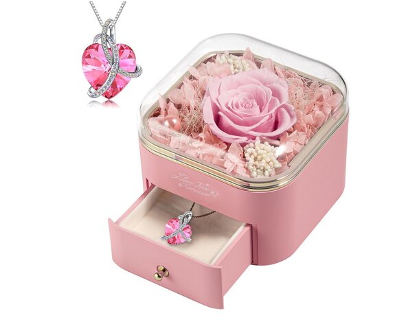 A pink rose nestled in a decorative box alongside a delicate necklace, creating an elegant gift presentation.