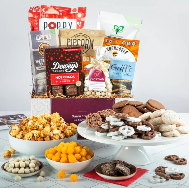 A beautifully arranged snack basket filled with various treats, including chips, nuts, and candies, perfect for sharing.