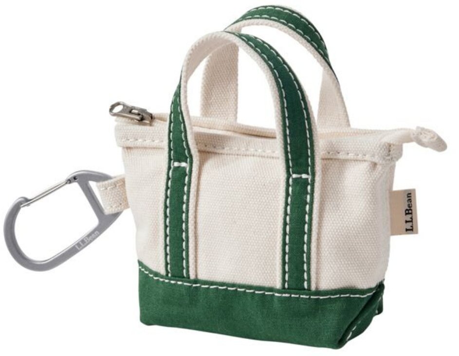 A small beige canvas tote bag with green accents and handles, featuring a carabiner clip on the side. The label reads "L.L.Bean." Simple and functional design.