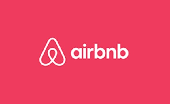 Airbnb logo on a pink background, featuring a stylized "A" symbol next to the brand name in white, conveying hospitality.