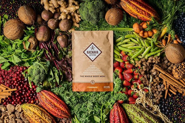 Image of a Ka'Chava product bag, on a background of whole ingredients.