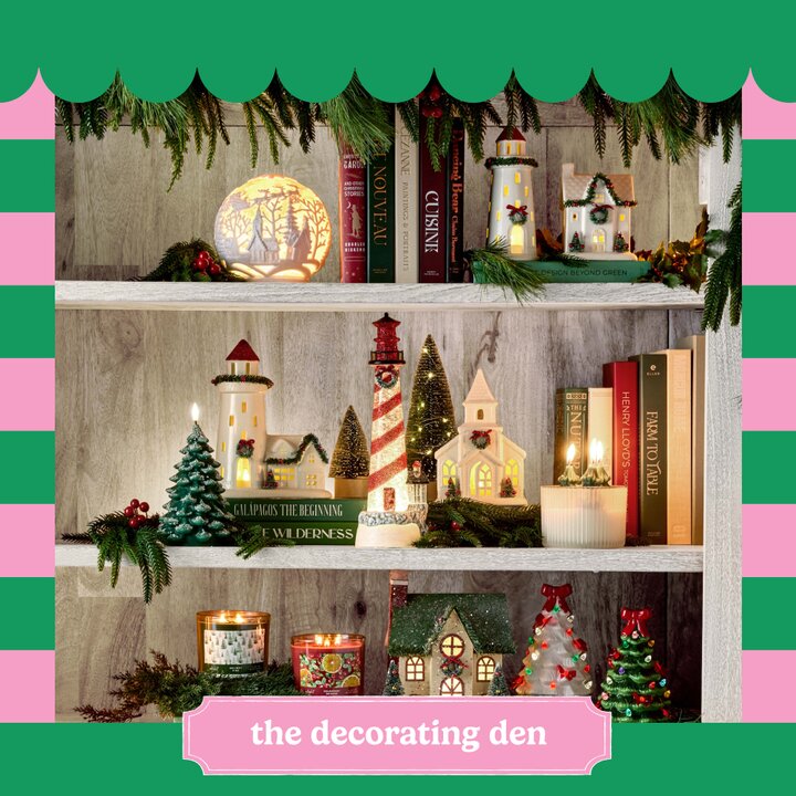 Image of three holiday decorated shelves with garland, candles, and festive Christmas houses