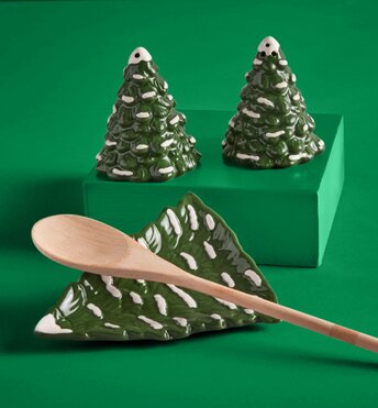 Ceramic dishes shaped like Christmas trees highlighting holiday serveware items for entertaining