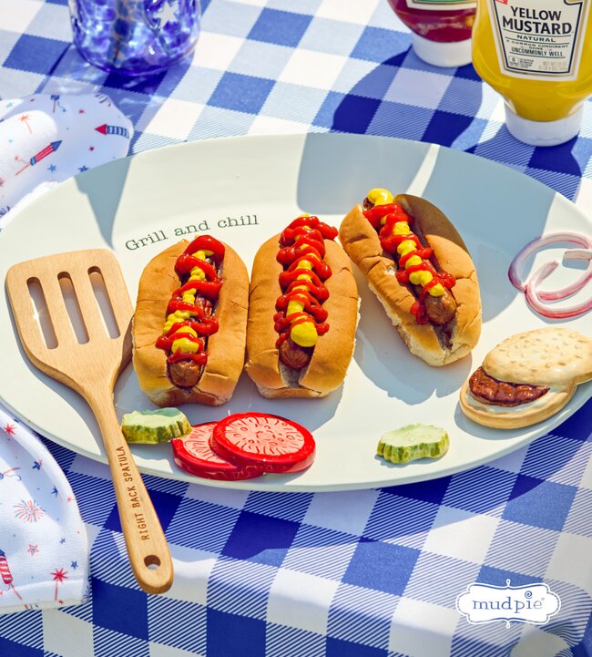 Mud Pie Grill and Chill platter with hotdogs on a blue gingham table 