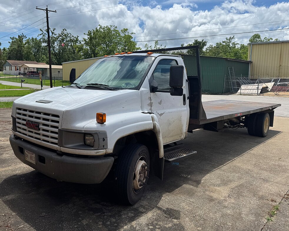 Delivery trucks at Booneville Lumber Company