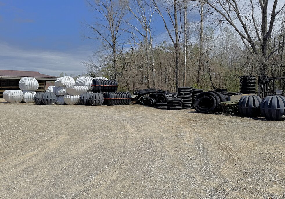 Septic tanks in the yard at Booneville Lumber Company.