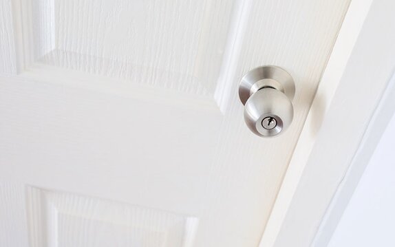 A lockset installed on an interior door.