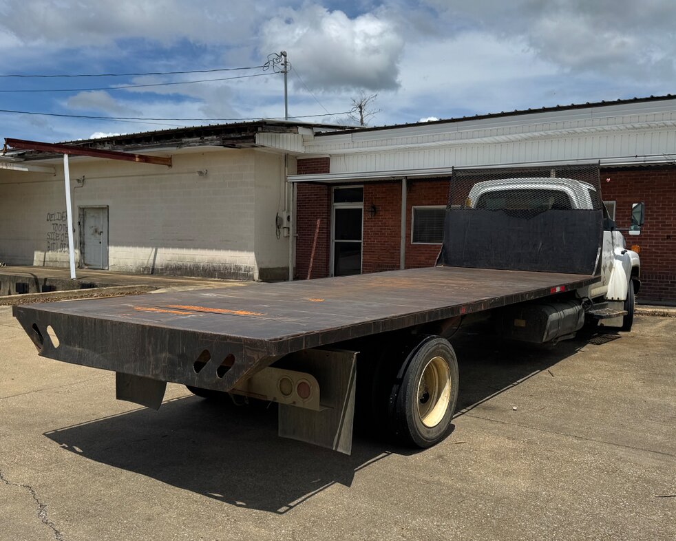 Delivery trucks at Booneville Lumber Company