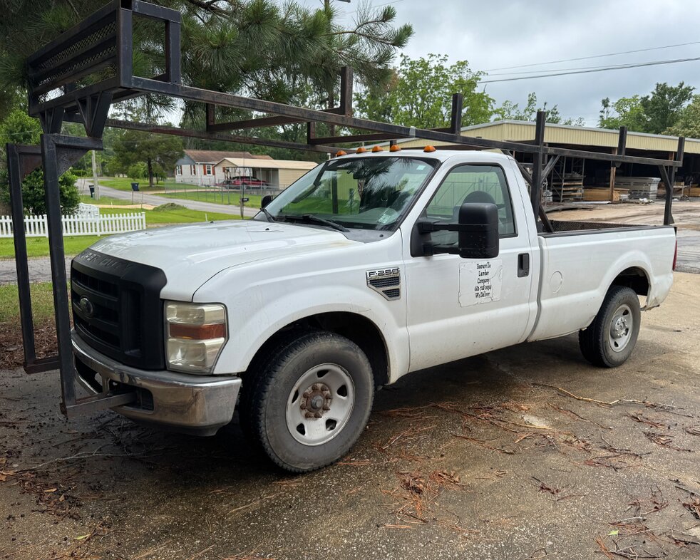 Delivery trucks at Booneville Lumber Company