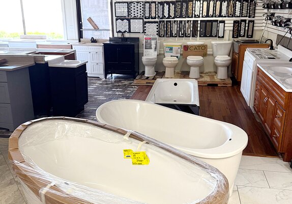 Tubs and toilets sold at Booneville Lumber Company. 