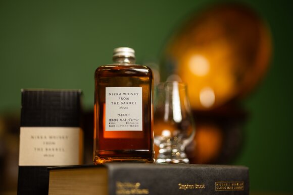 Bottle of Kopke White Port On Ice alongside a chilled glass of white port served over ice