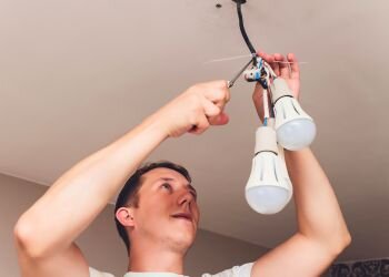 Man fixing lamp